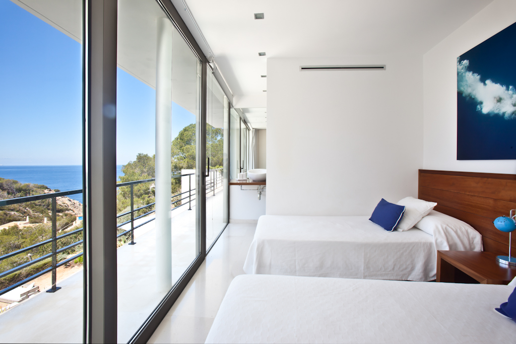 Habitación camas dobles en una casa en Ibiza